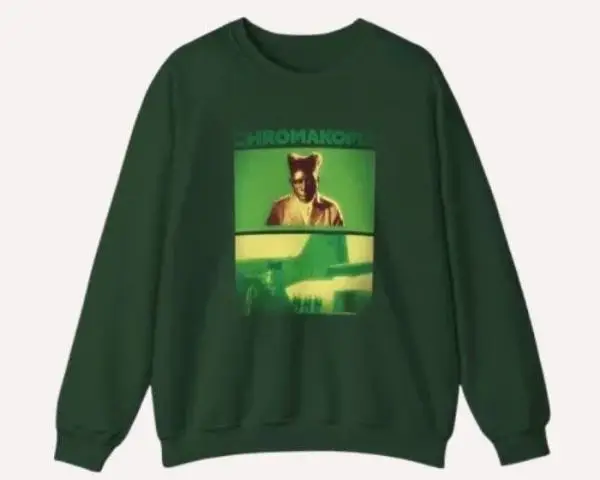 Tyler the Creator merch flat lay with hoodie, graphic t-shirt, Chromakopia tour poster, Odd Future cap, and Golf Wang sneakers.